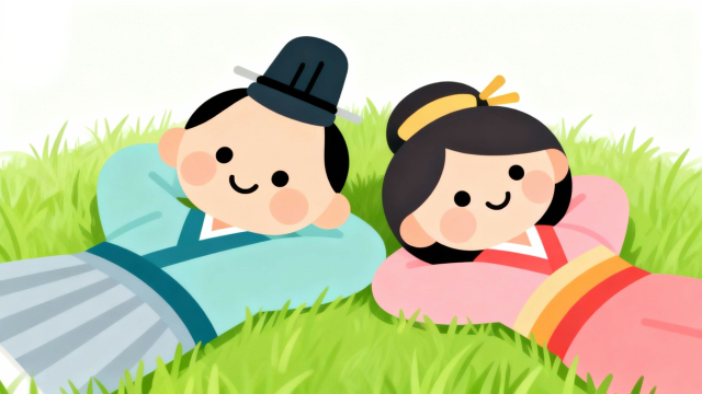 芝生で寝転がる雄雛と雌雛